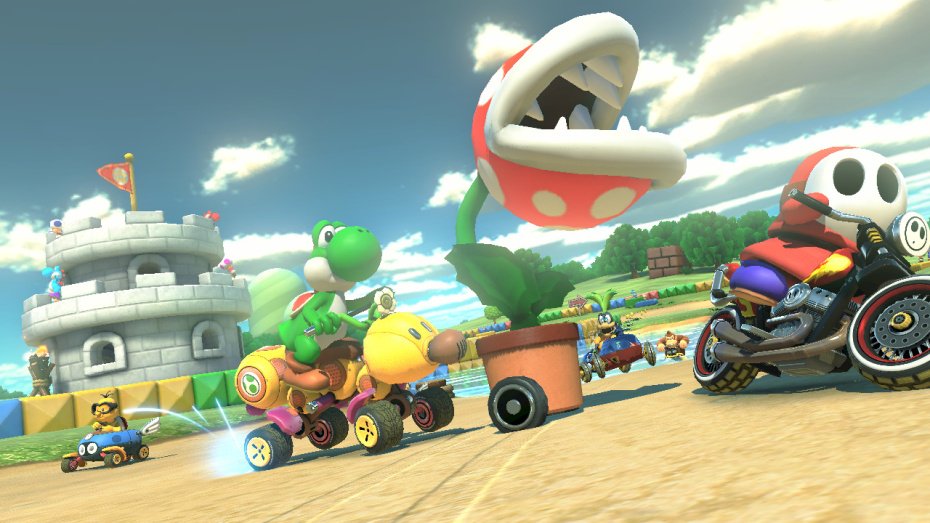Mario Kart 8 kurvailee trailereilla ja sateenkaaritien kuvilla