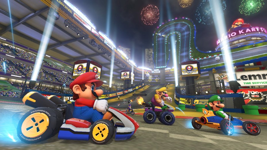 Mario Kart 8 kurvailee trailereilla ja sateenkaaritien kuvilla
