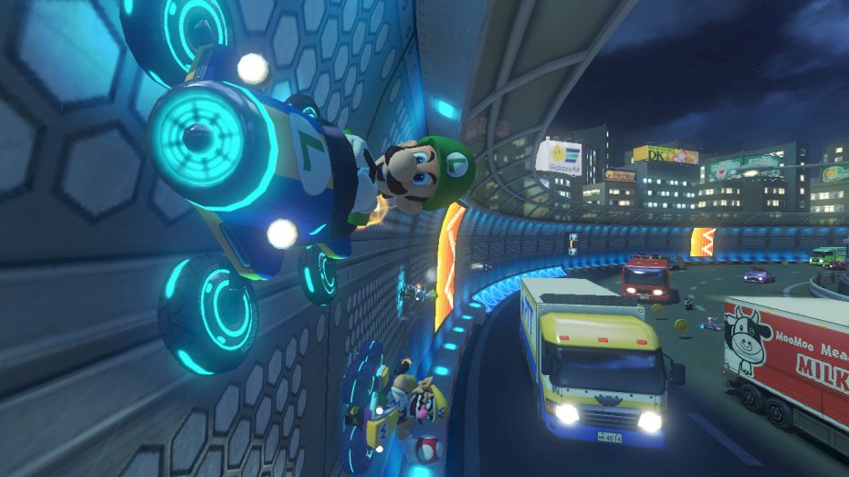 Mario Kart 8 kurvailee trailereilla ja sateenkaaritien kuvilla
