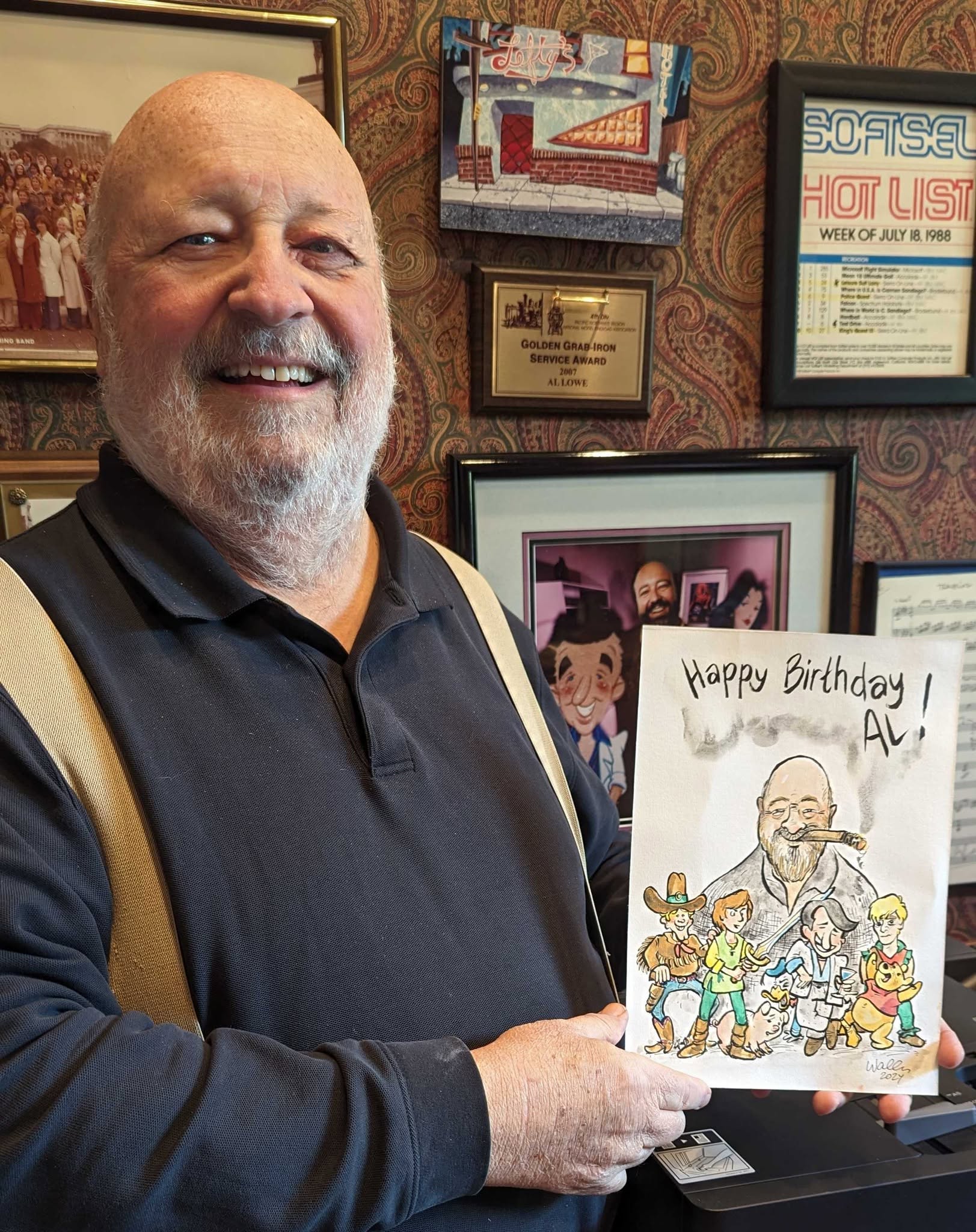 Al Lowe holding a drawing about him celebrating his birthday.Pictures is done by Harri "Wallu" Vaalio
